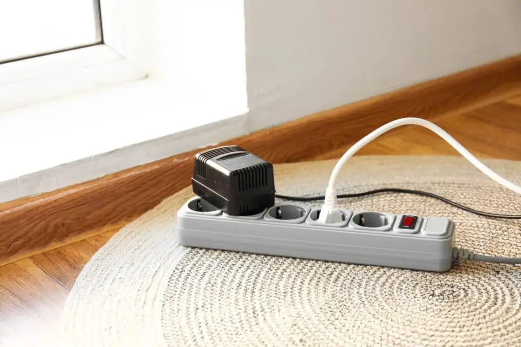extension cord under carpet